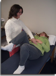 Rebecca Kirgan, Physical therapist and owner of Atlantic Physical Therapy works with a patient on Spine Stabilization techniques